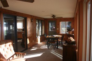 4-season porch overlooks the yard and lake.